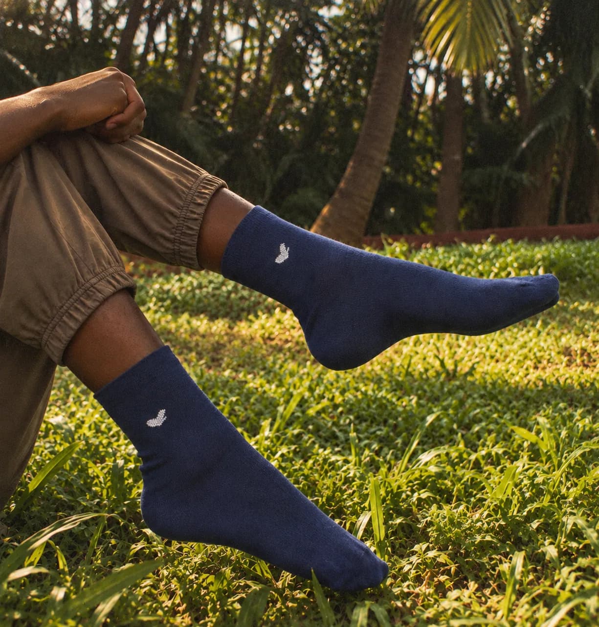 Navy socks worn stretched out on the grass