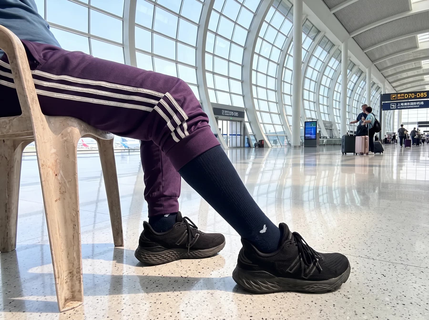 Cirrus Navy worn with black trainers in an airport terminal
